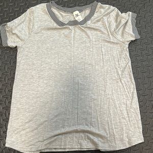 Brand new without tags soft tee. Has some striping on sleeves and neckline. Soft